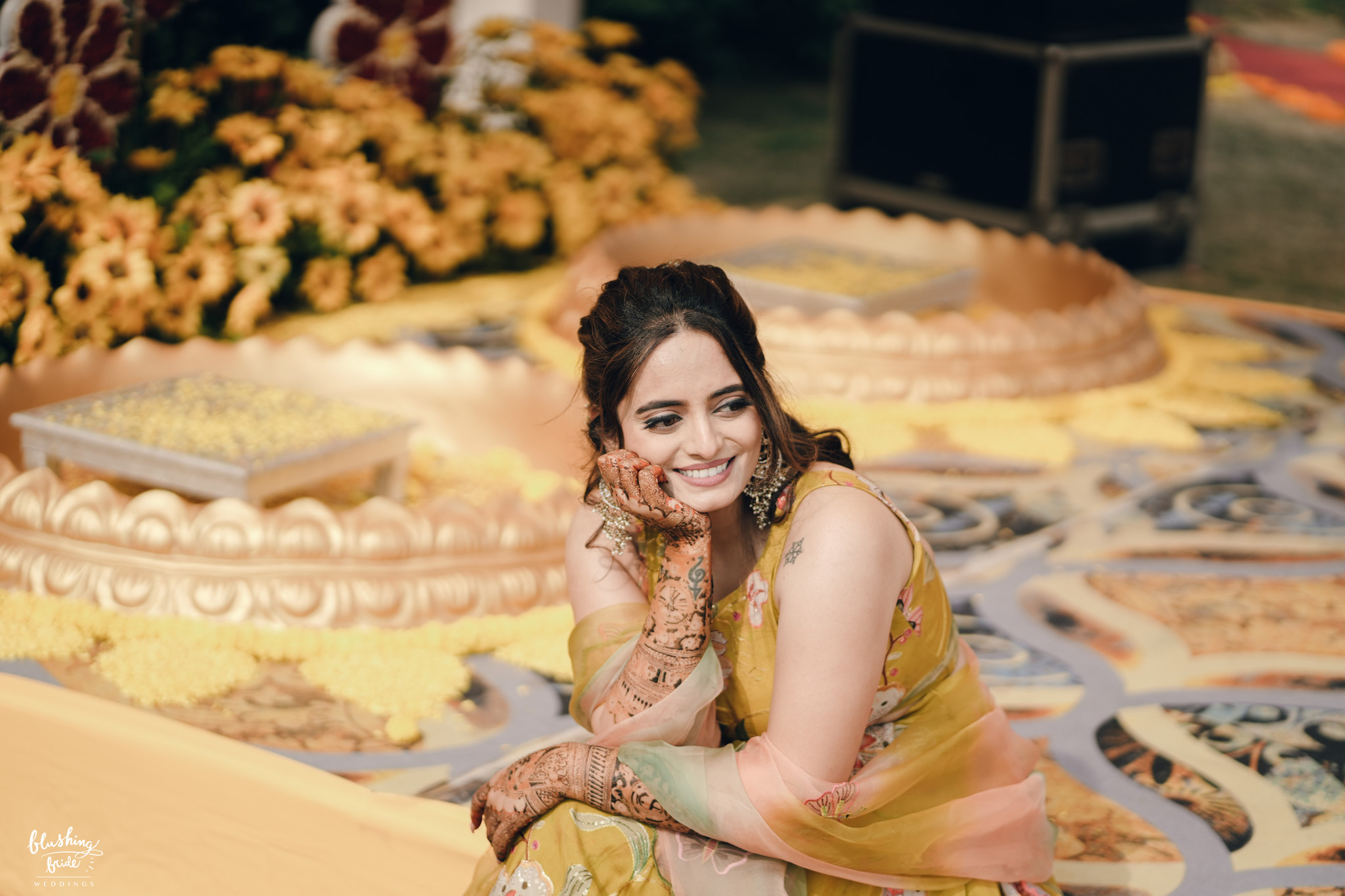 Bride in yellow at her haldi ceremony
